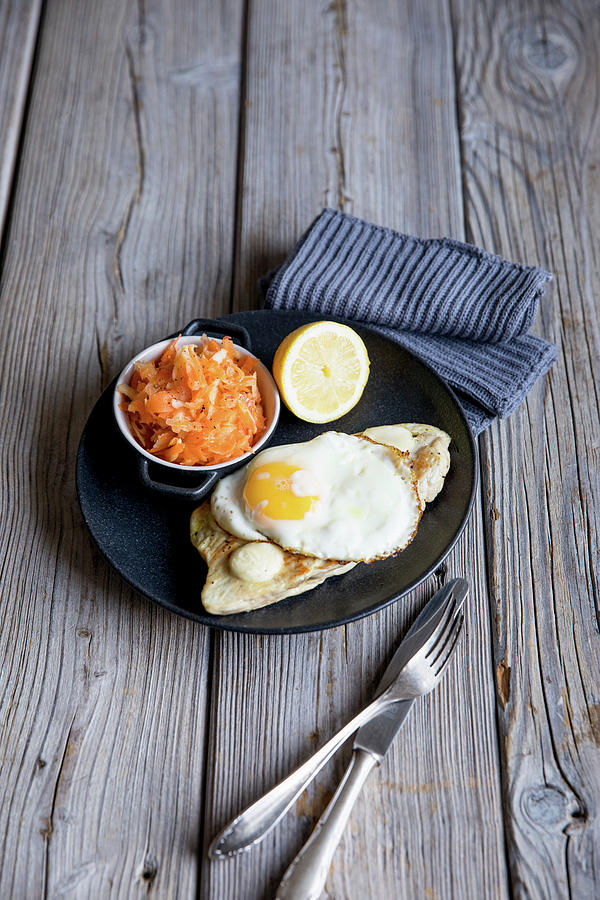 Turkey Escalope With Mozzarella And A Fried Egg, Served With A Root Vegetable Salad Photograph by Claudia Timmann