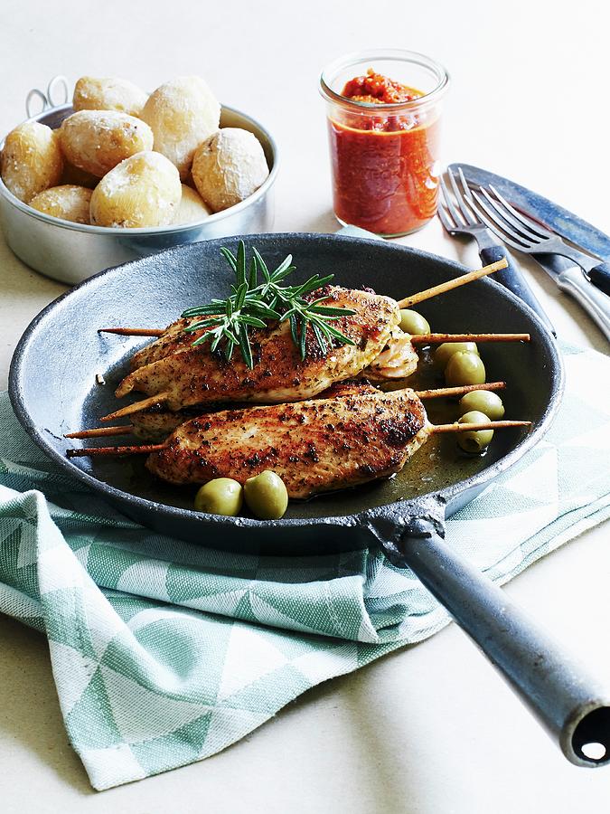 Turkey Escalopes With An Olive Marinade On Skewers Served With Salted ...