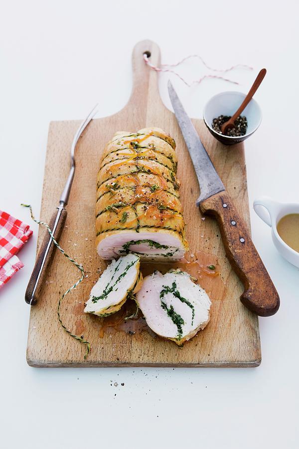 Turkey Roulade Filled With Herbs, Sliced Photograph by Michael Wissing
