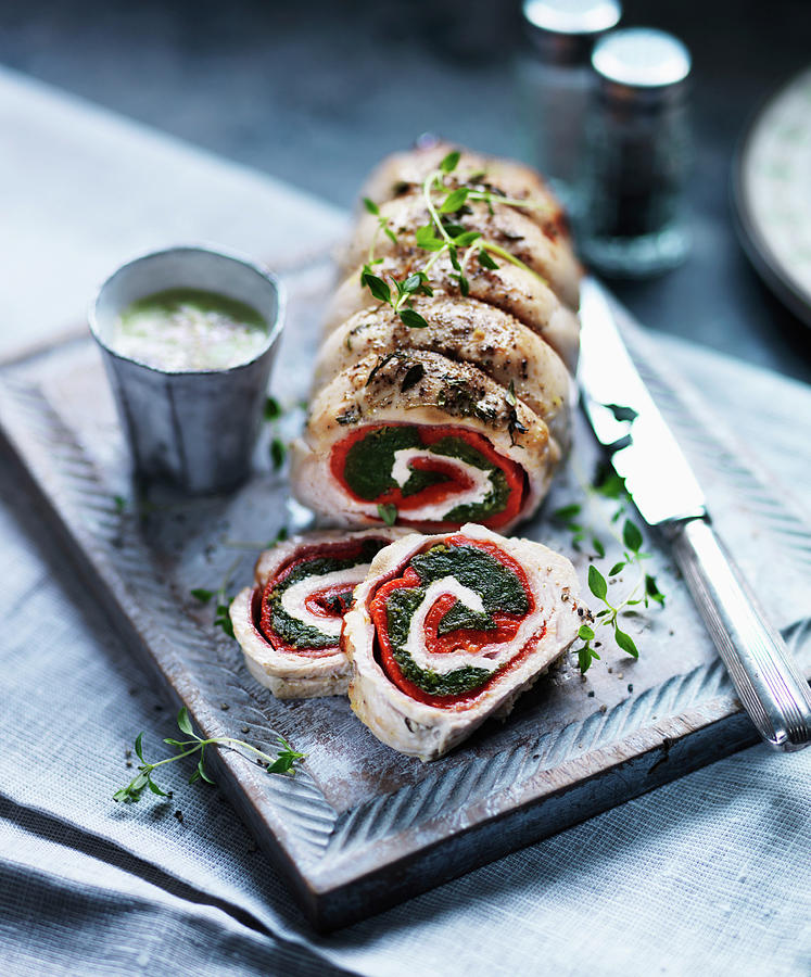 Turkey Roulade Filled With Herbs, Tomatoes And Cheese, Sliced Photograph by Karen Thomas