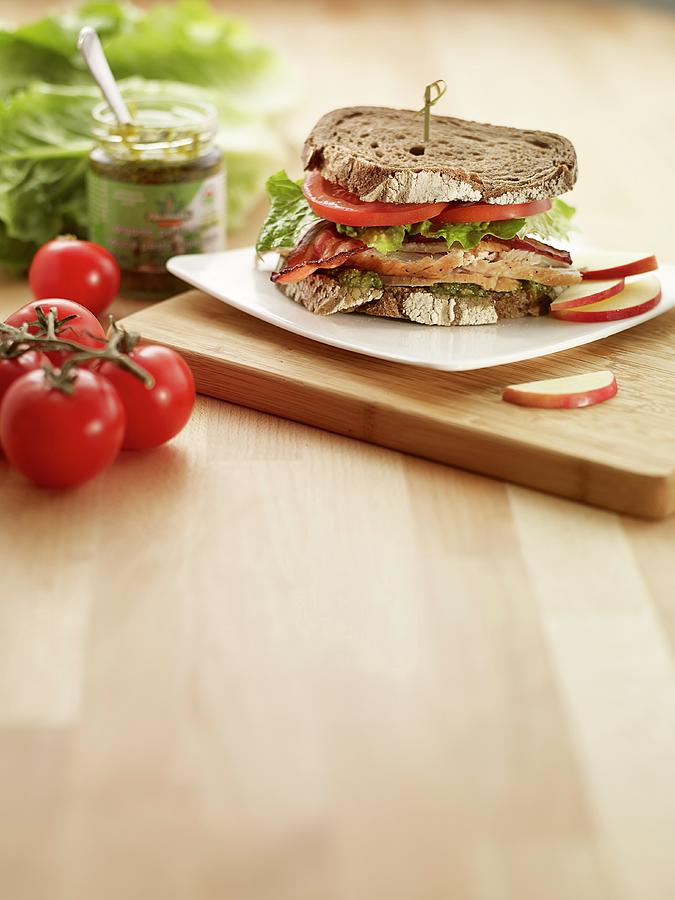 Turkey Sandwich With Bacon And Tomatoes Photograph by Clinton Hussey