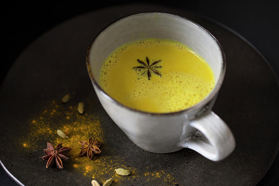 Turmeric Latte In A Cup Photograph by Nicole Godt