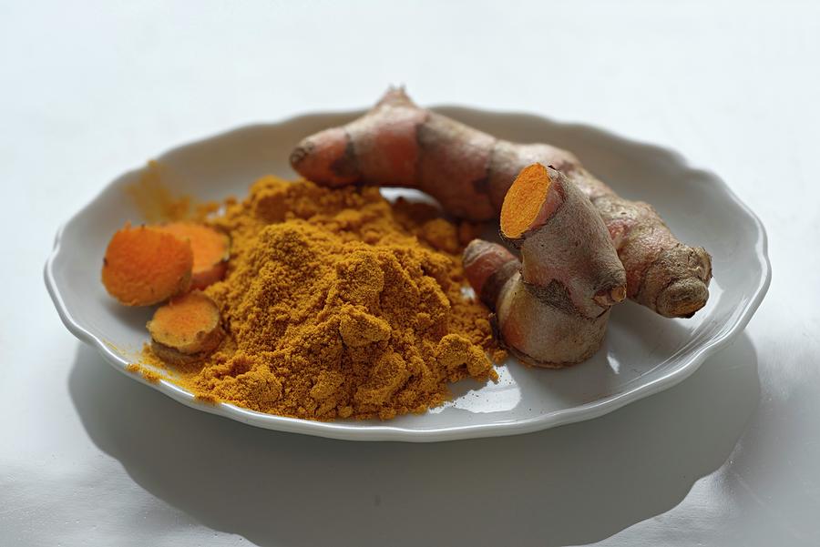 Turmeric Powder And Turmeric Roots Photograph by Dr. Martin Baumgrtner