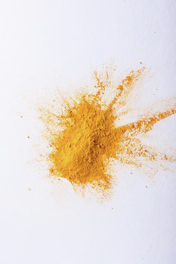 Turmeric Powder On White Background Photograph by Nitin Kapoor