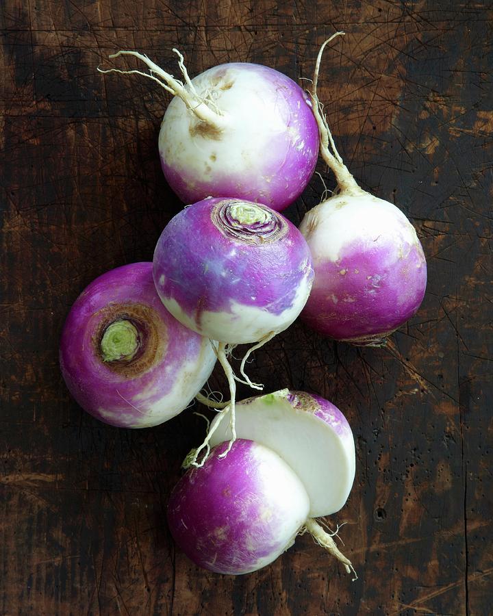 Turnips On A Wooden Surface Photograph by Antonis Achilleos