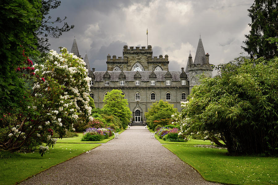 Turreted Inveraray Castle in Gothic Revival style from the flowe Photograph by Reimar Gaertner