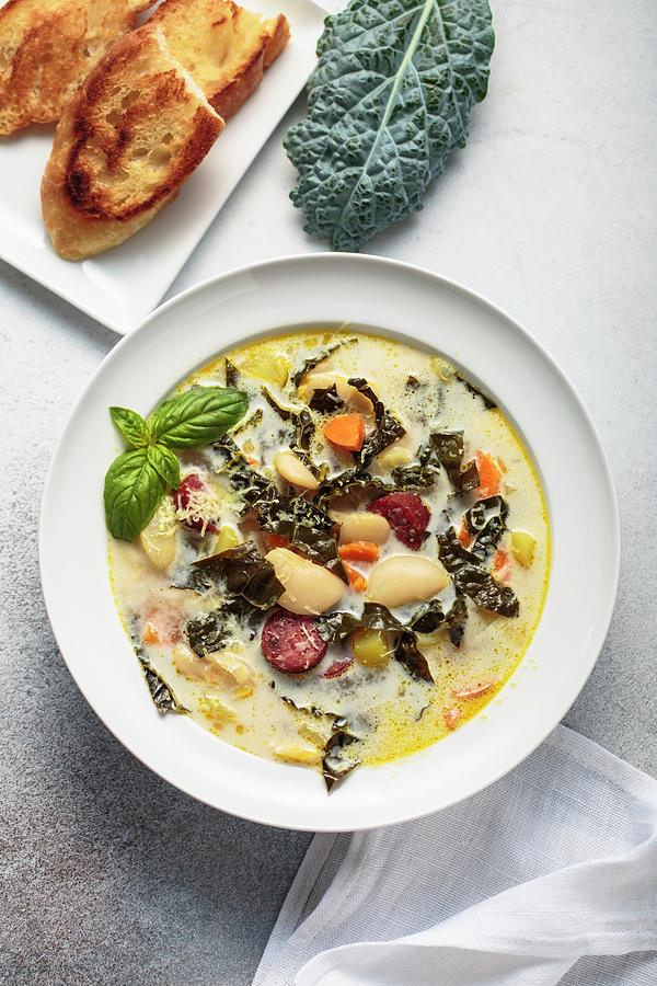 Tuscan-style Lacinato Kale And White Bean Soup With Sausage Photograph by Andrey Maslakov