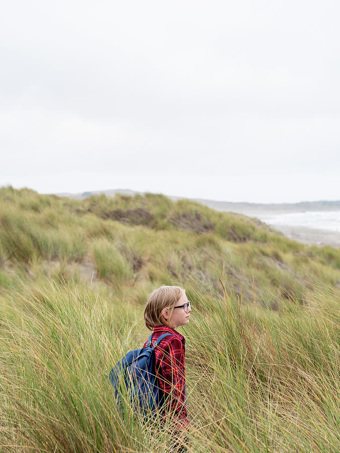 Point Reyes National Seashore Photograph - Tween Boy Standing In Tall Grass On Beach by Cavan Images