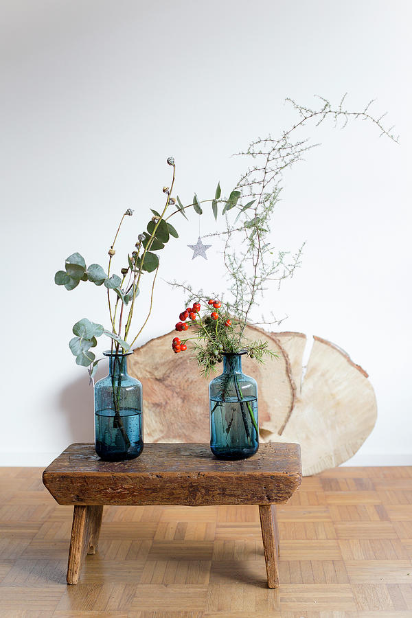 Twigs In Two Blue Vases On Old Wooden Stool Photograph by Iris Wolf