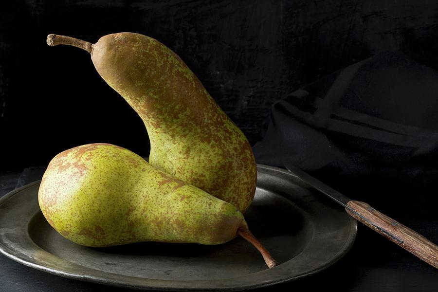 Two Abate Fetel Pears On An Old Tin Plate With A Knife Photograph by Shawn Hempel