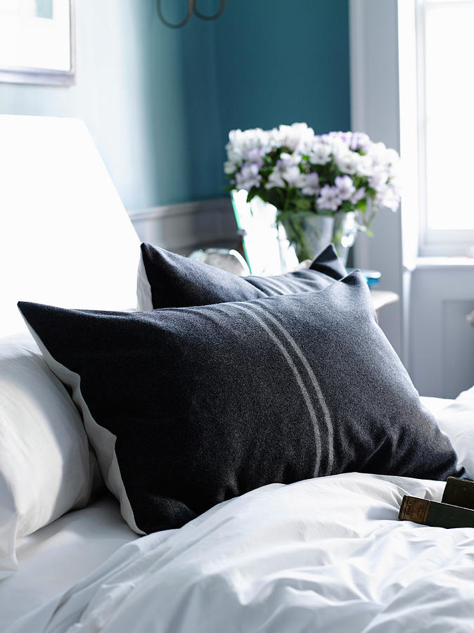 Two Anthracite Pillows With Pale Grey Strips On White Bedlinen Photograph by Catherine Gratwicke