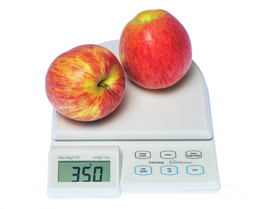Two Apples On A Digital Kitchen Scale Photograph by Martyn F. Chillmaid/science Photo Library