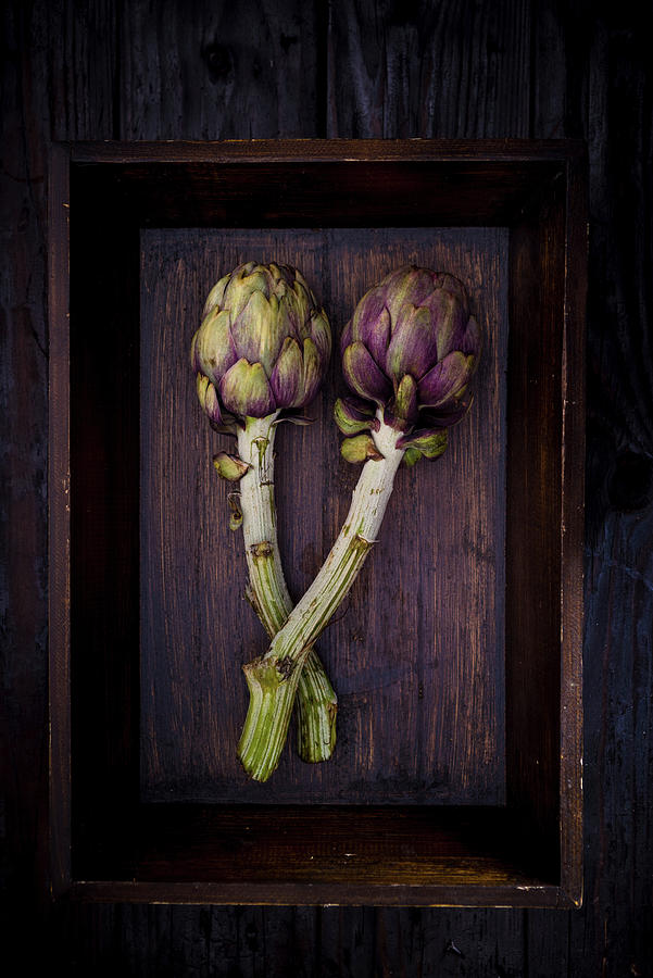 Two Artichokes On A Wooden Tray Photograph by Nitin Kapoor