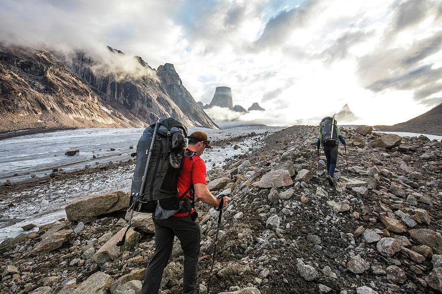 Two Backpackers Hike Over Glacial Moraine To Reach Mountains Ahead ...