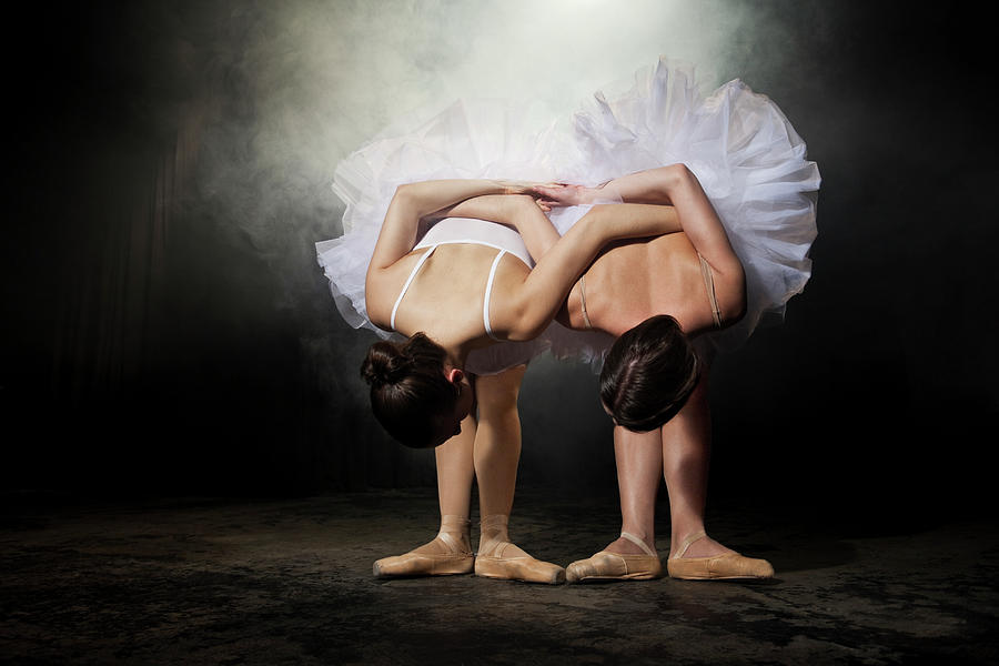 Two Ballerinas Stretching On Stage Photograph by Nisian Hughes Two Ballerinas Stretching On Stage Photograph by Nisian Hughes