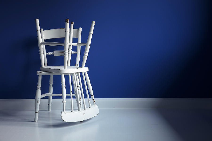 Two Battered White Windsor Chairs Against Blue Wall Photograph by Roberto Rabe