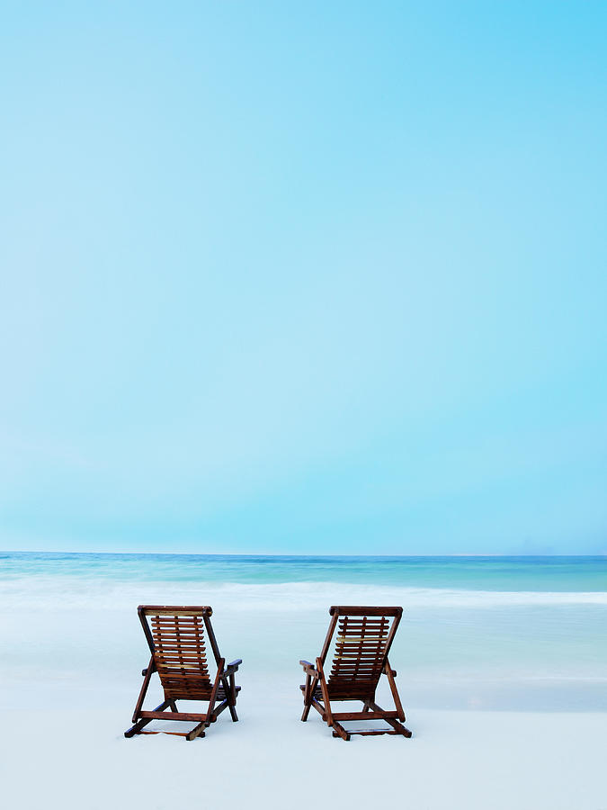 Two Beach Chairs On Tropical Beach At Photograph by Thomas Barwick