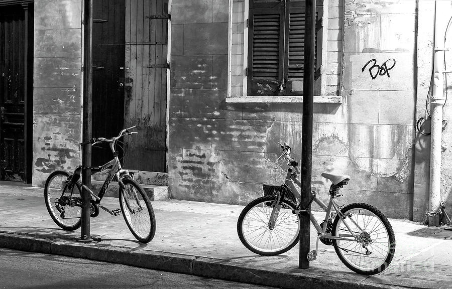 Two Bicycles at Night in New Orleans Photograph by John Rizzuto