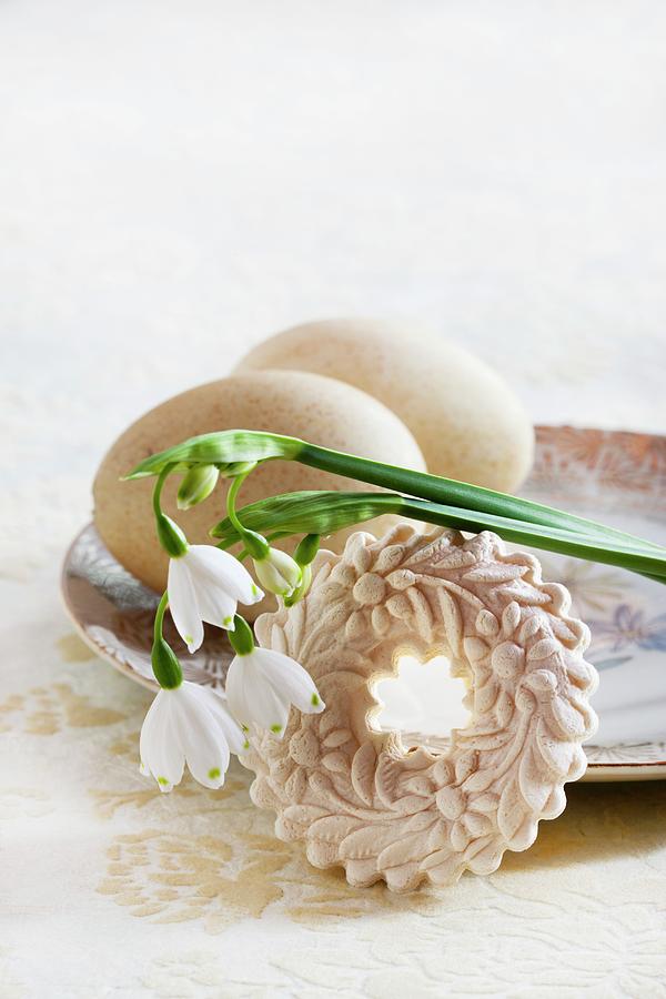 Two Blown Turkeys Eggs On Vintage Plate With Moulded Aniseed Biscuit And Spring Snowflake Flowers Photograph by Sabine Lscher