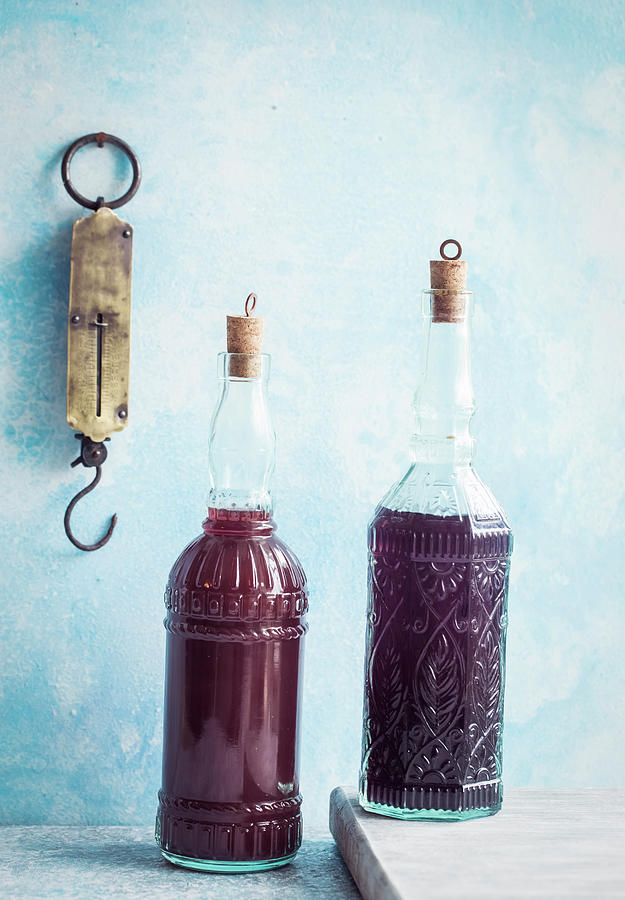 Two Bottles Of Homemade Cranberry Juice Photograph by Andrey Maslakov