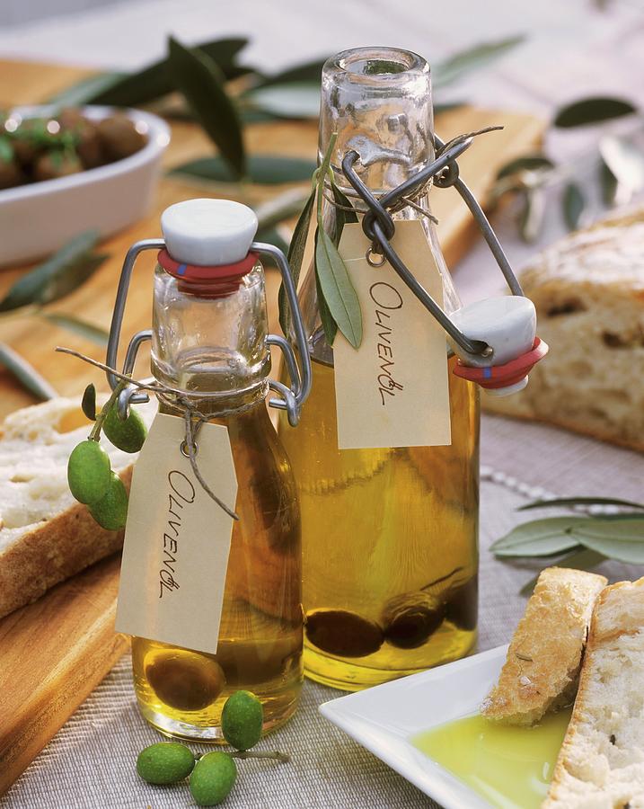 Two Bottles Of Olive Oil, Marinated Olives, Ciabatta Photograph by Strauss, Friedrich