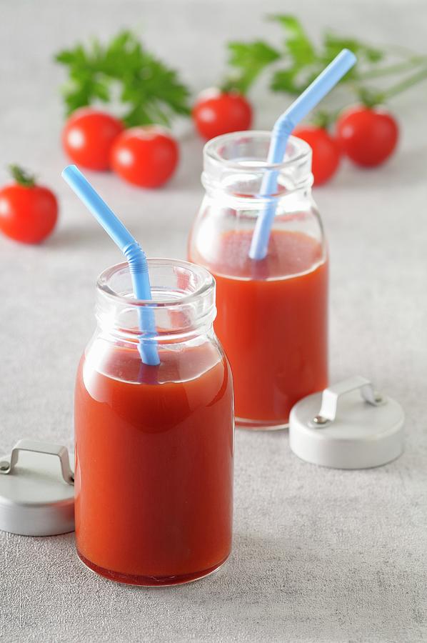Two Bottles Of Tomato Juice With Straws Photograph by Jean-christophe Riou