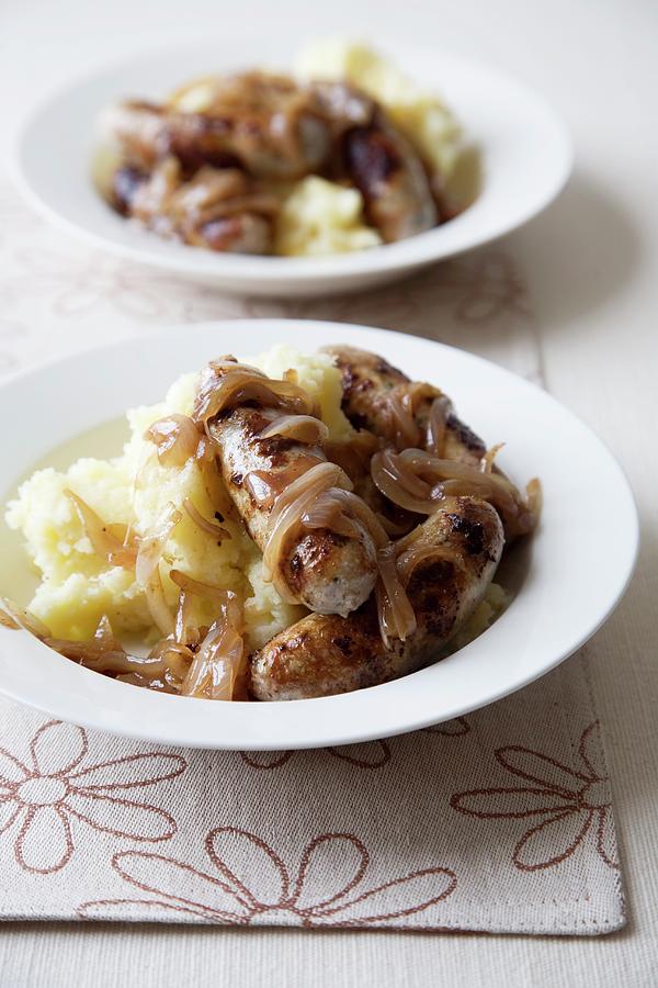 Two Bowls Of Bangers And Mash With Onions Photograph by Joy Skipper Foodstyling