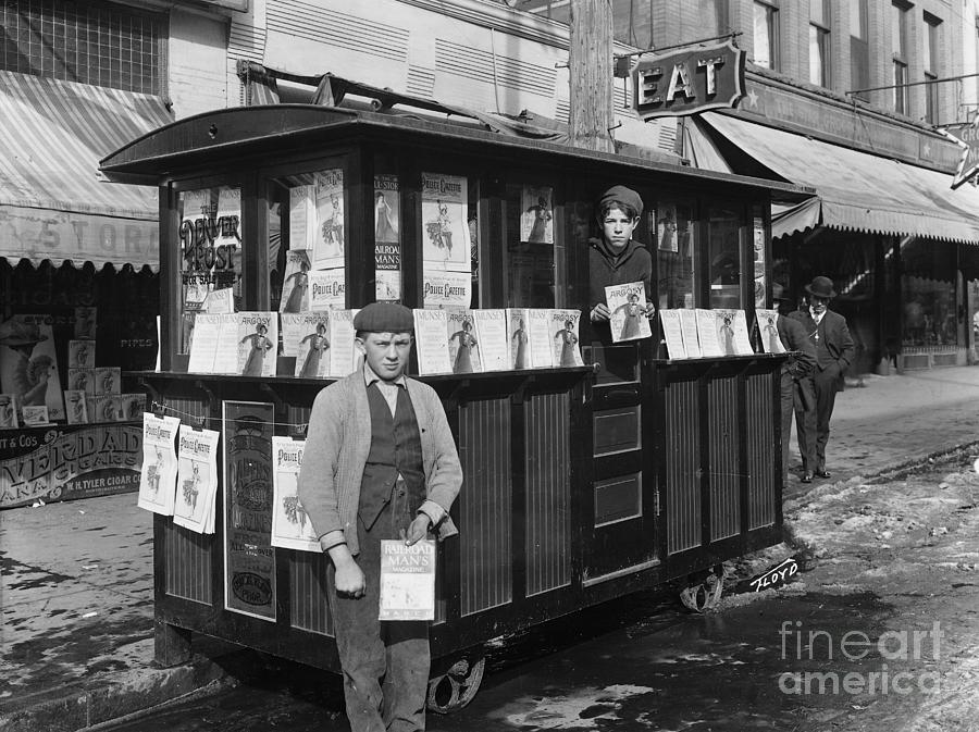 Two Boys Holding Magazines At Newsstand Photograph by Bettmann