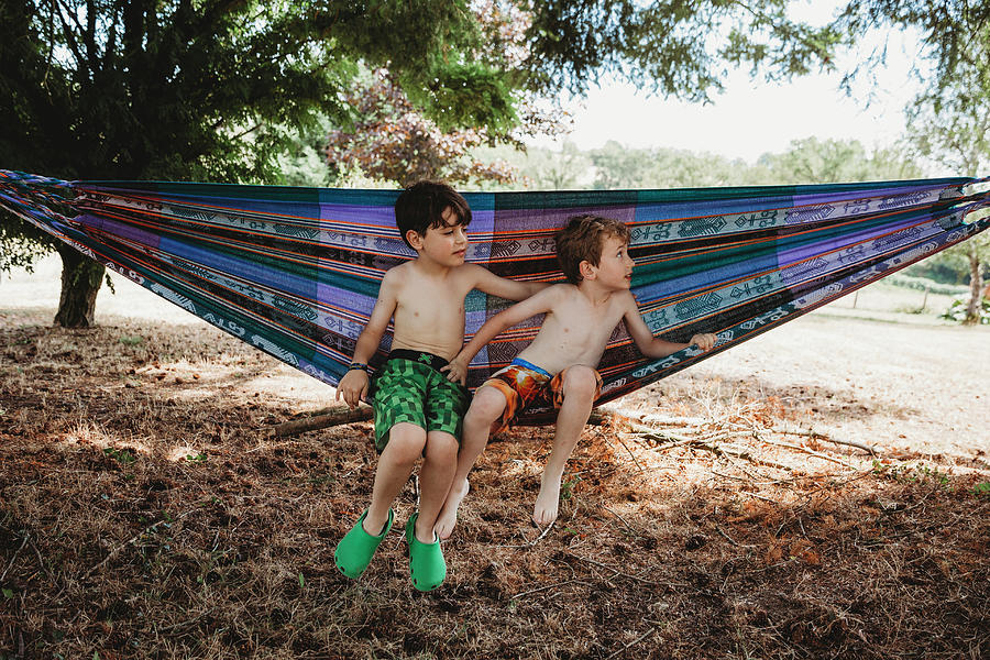 Tree Photograph - Two Boys Sitting In Hammock by Cavan Images