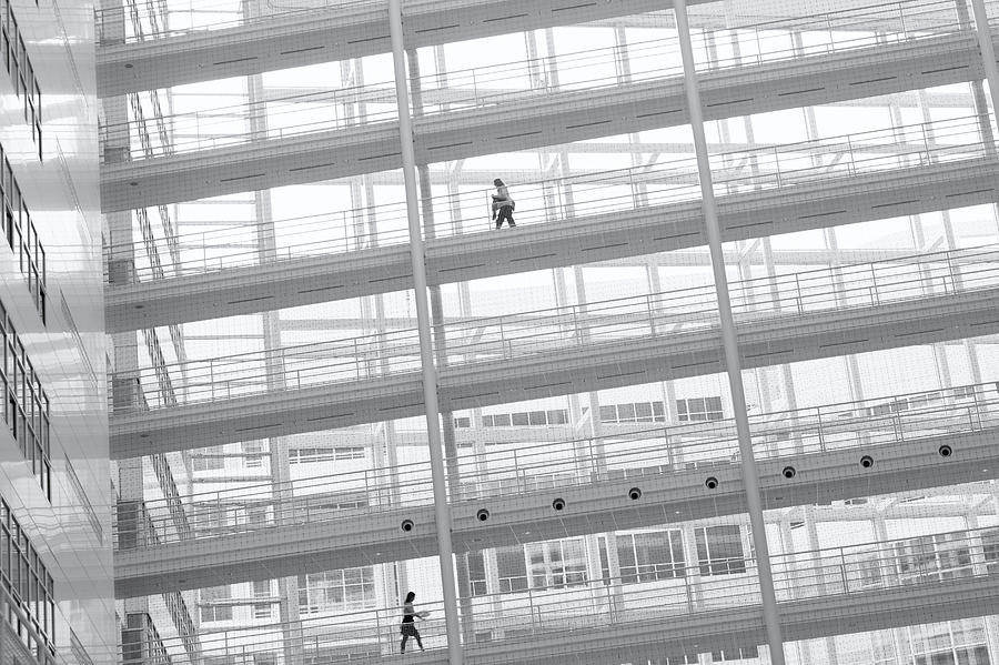 Two Business Woman Walking On Elevated Photograph by 77studio