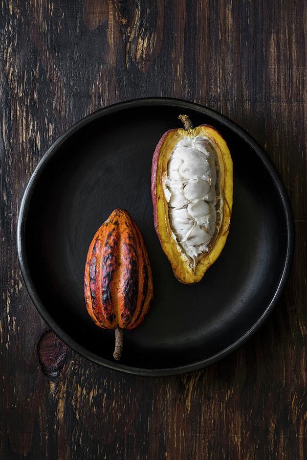 Two Cacao Pods, Whole And Sliced Open seen From Above Photograph by Maru Aveledo