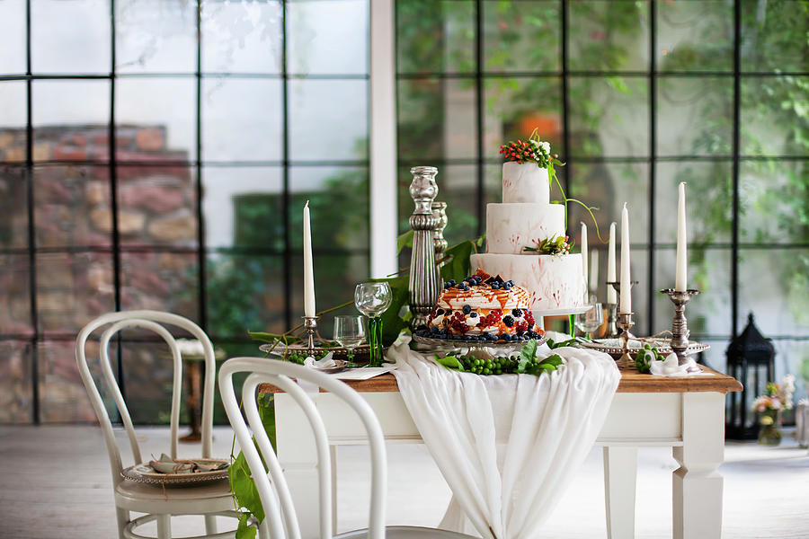 Two Celebration Cakes On Set Country-house Table In Industrial Building Photograph by Alicja Koll