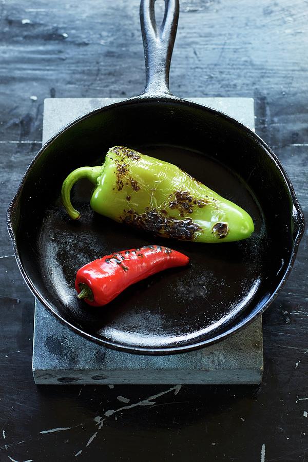 Two Charred Jalapeo Peppers In A Cast-iron Pan Photograph by Michael S. Harrison