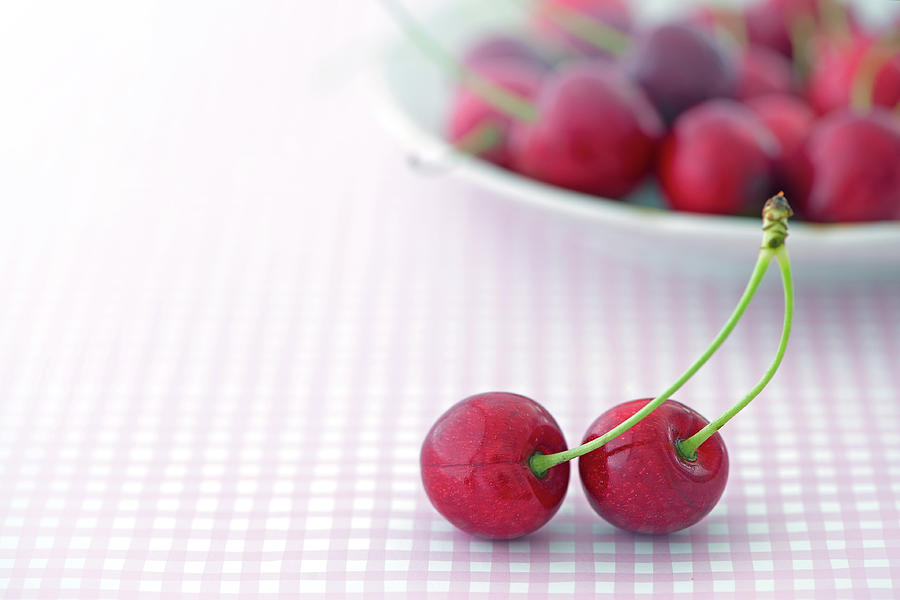 Two Cherries On Table Photograph by Elisabeth Schmitt