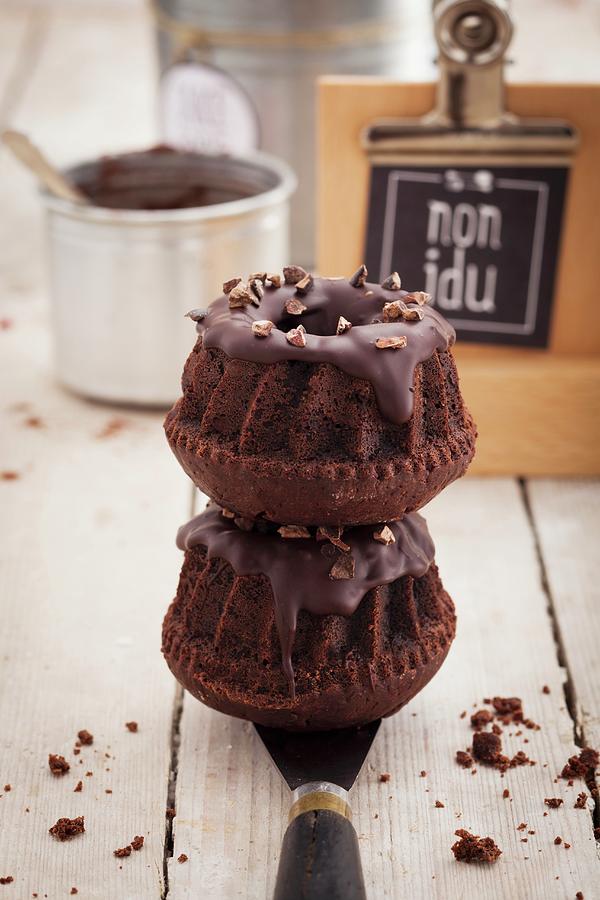 Two Chocolate Bundt Cakes On Top Of Each Other In A Food Truck Photograph by Eising Studio - Food Photo & Video