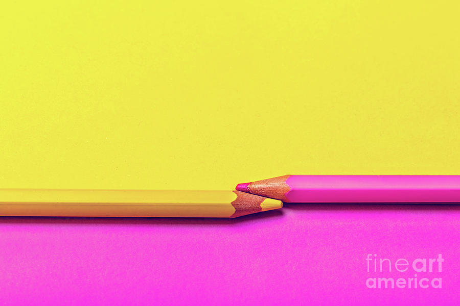 Crayon Photograph - Two colored pencils on pink and yellow background. by Michal Bednarek
