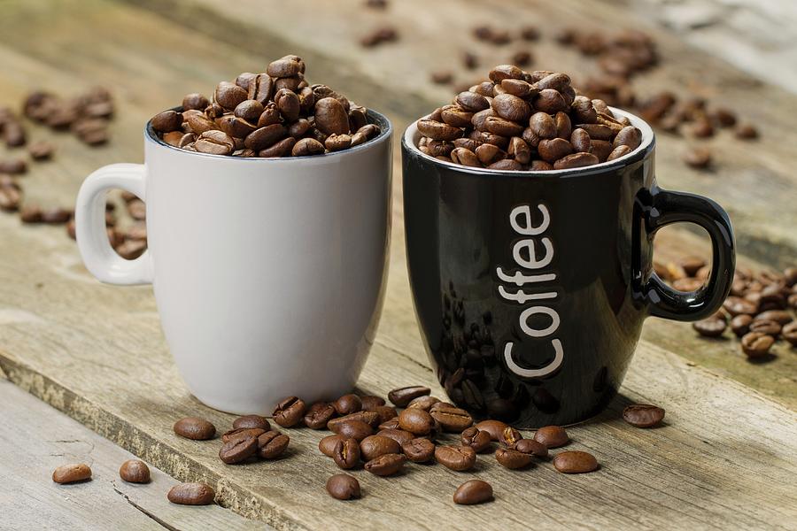 Two Cups Filled With Coffee Beans Photograph by Uwe Merkel