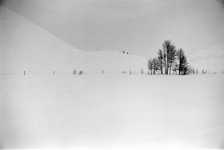 Two Distant Figures Climbing Hill In A Photograph by Alfred Eisenstaedt Two Distant Figures Climbing Hill In A Photograph by Alfred Eisenstaedt