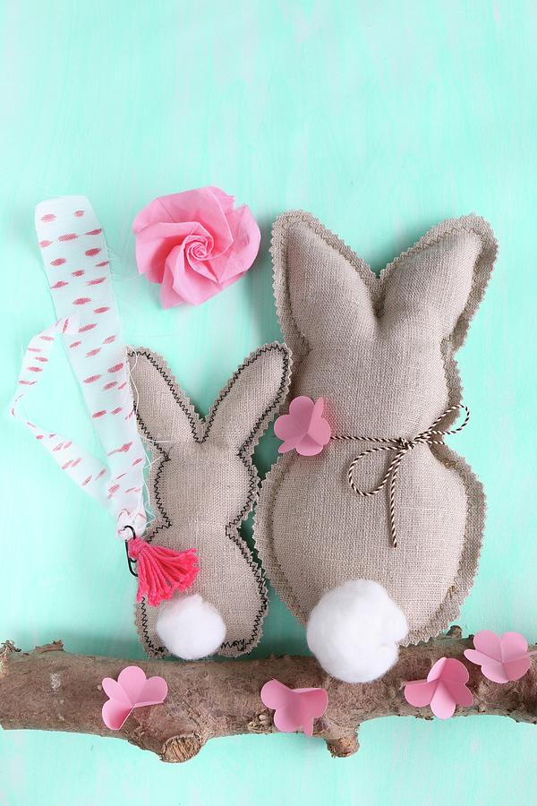 Two Fabric Rabbits And Paper Flowers On Branch Photograph by Regina Hippel