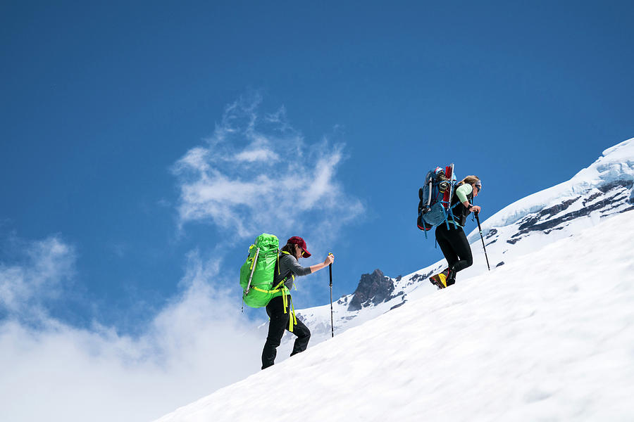 Two Female Mountaineers Hike Above Cloudline On Mt. Baker, Wa ...