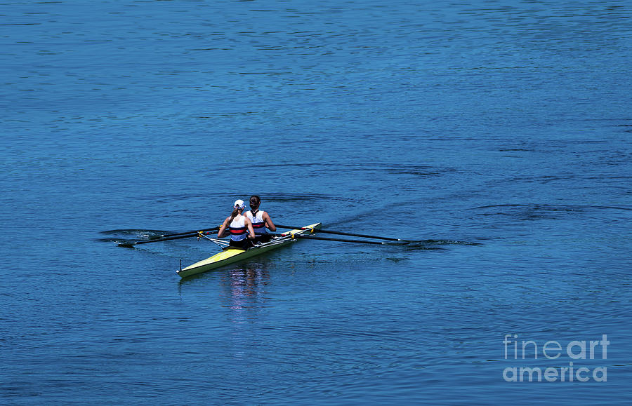 Two Female Rowers In A Double Racing Boat With Synchronous Oar Stroke Photograph by Andreas Berthold