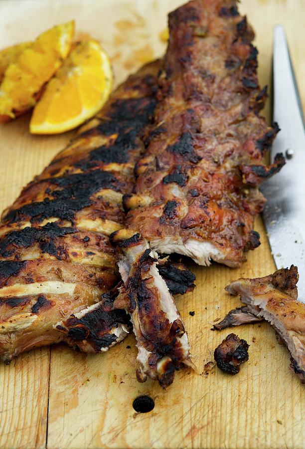Two Full Racks Of Baby Back Pork Ribs On Cutting Board Photograph by Tim Winter