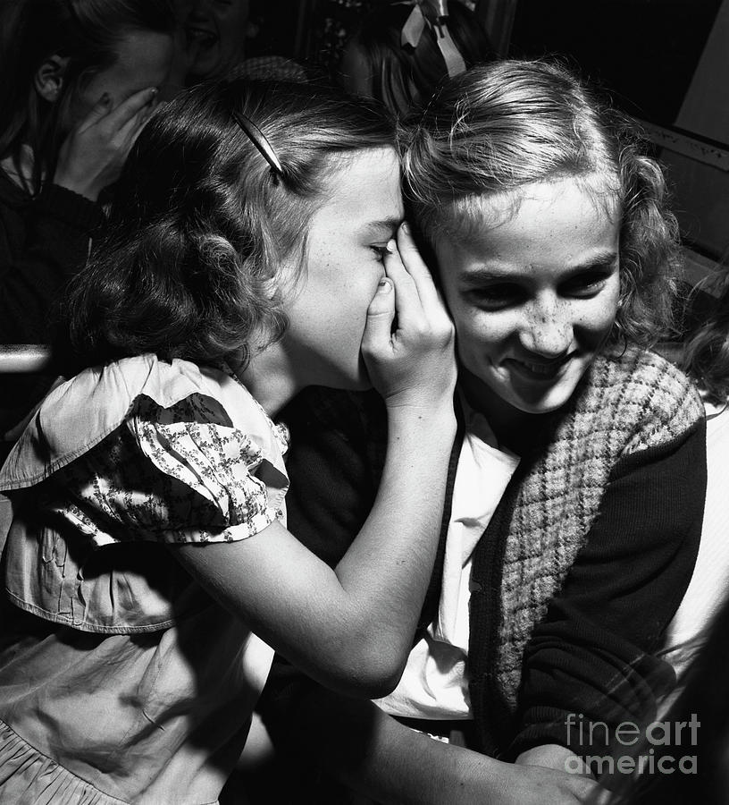 Two Girls Sharing A Secret Photograph by Bettmann