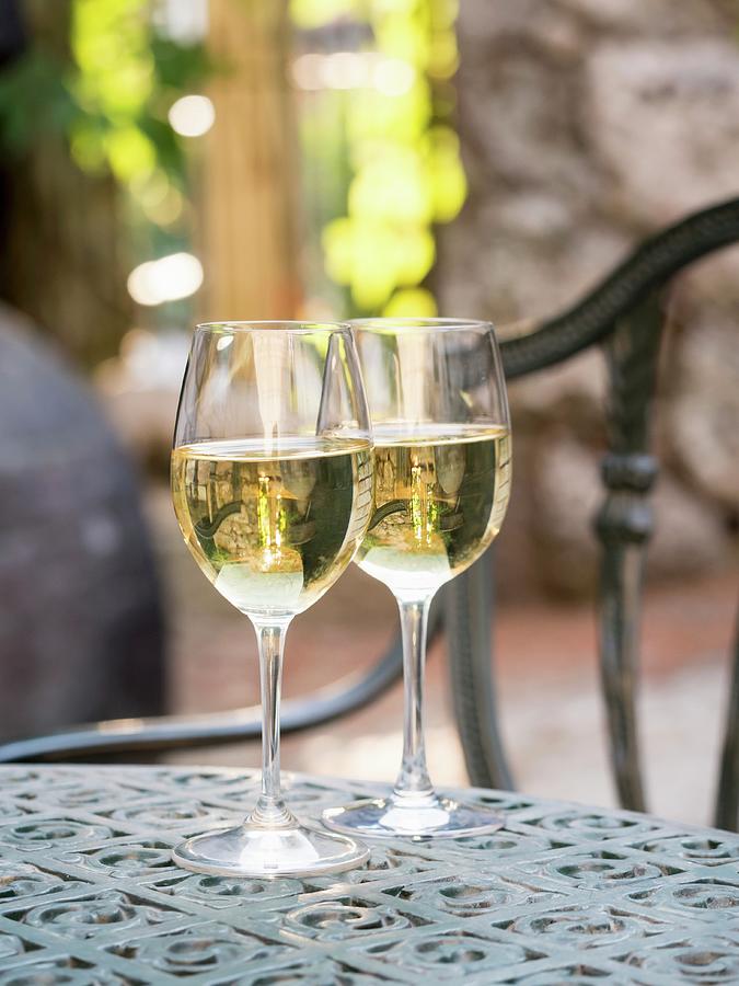 Two Glasses Of Albarino White Wine Served At A Vineyard In Galicia, Spain Photograph by Magdalena Paluchowska