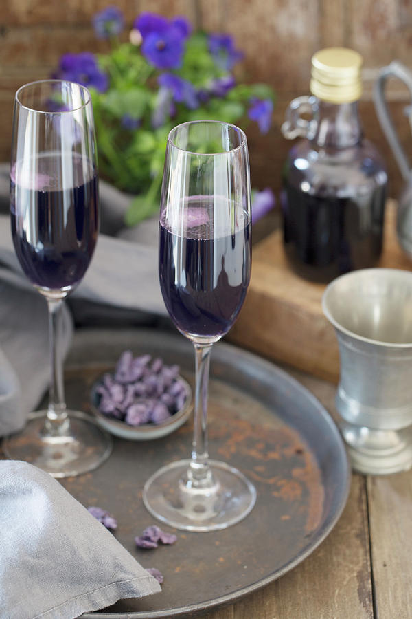 Two Glasses Of Champagne With Violet Syrup From Toulouse On A Tray Photograph by Nicole Godt