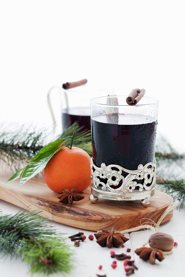 Two Glasses Of Mulled Wine With Spices And Sprigs Of Fir Photograph by Jane Saunders