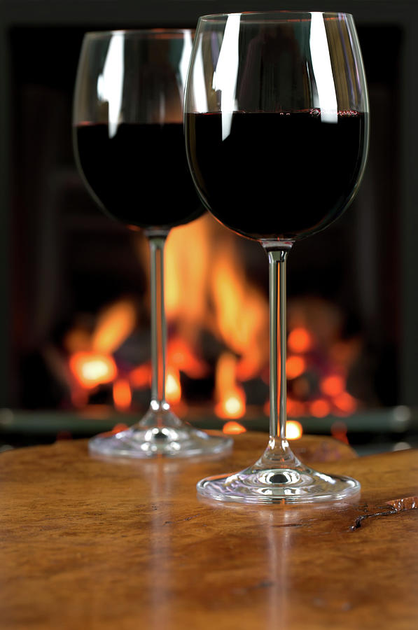 Two Glasses Of Red Wine On Table With Photograph by Dmp1