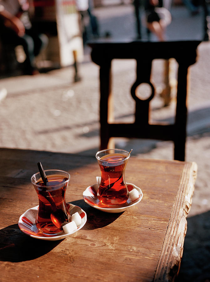 Two Glasses Of Turkish Tea On A Table Photograph by Gary Yeowell