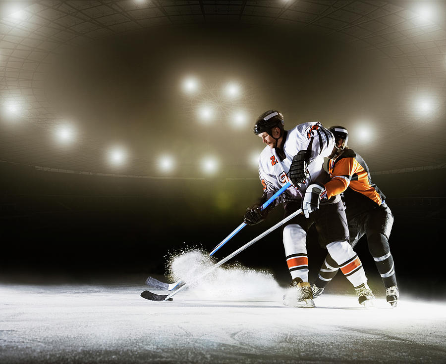 Two Ice Hockey Players Competing For Photograph by Robert Decelis Ltd