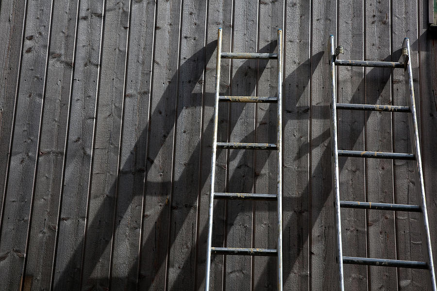 Two Ladders Leaning Against A Wooden Photograph by Meera Lee Sethi